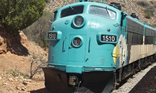 A large train travelling through hills in Southern Arizona