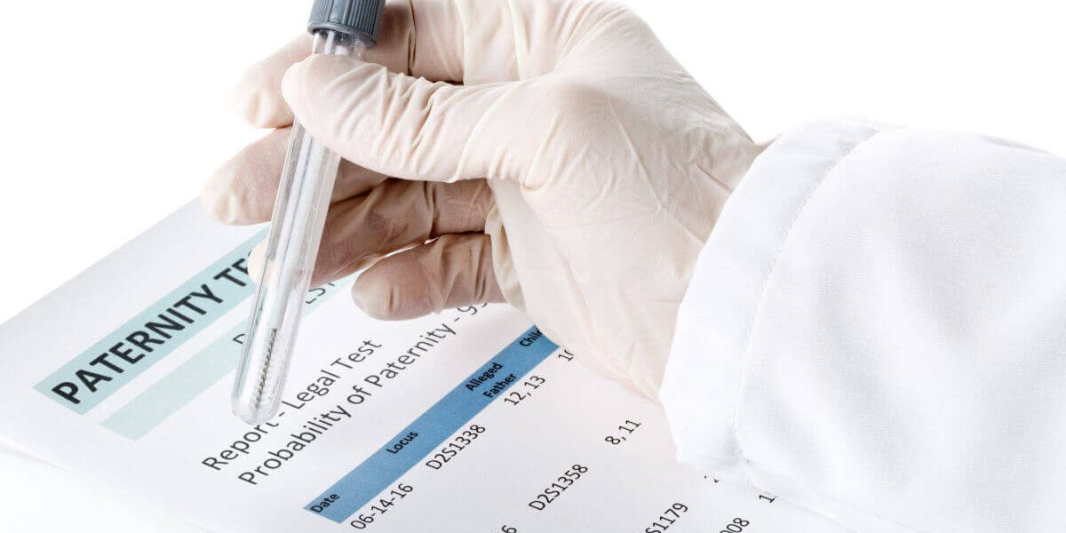 Lab technician holding a test tube performing a paternity test