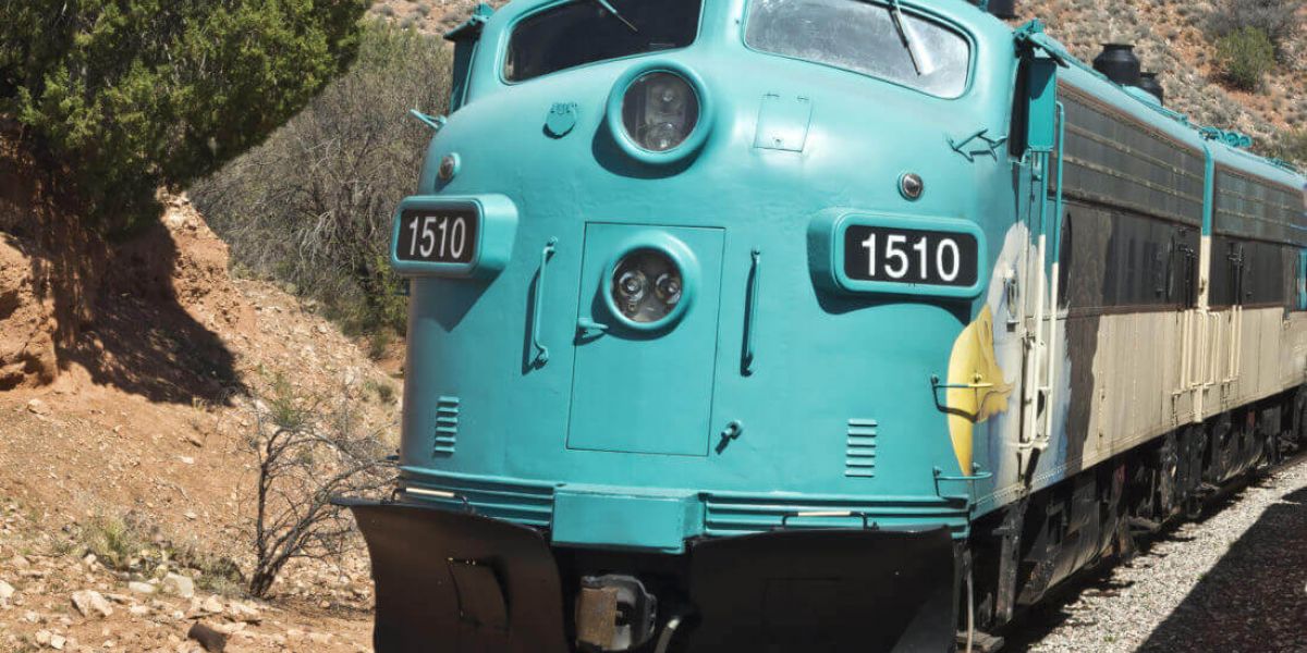 A large train travelling through hills in Southern Arizona