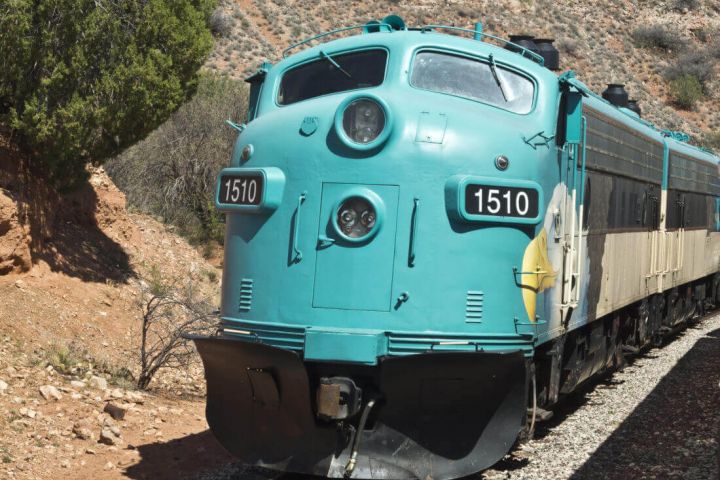 A large train travelling through hills in Southern Arizona