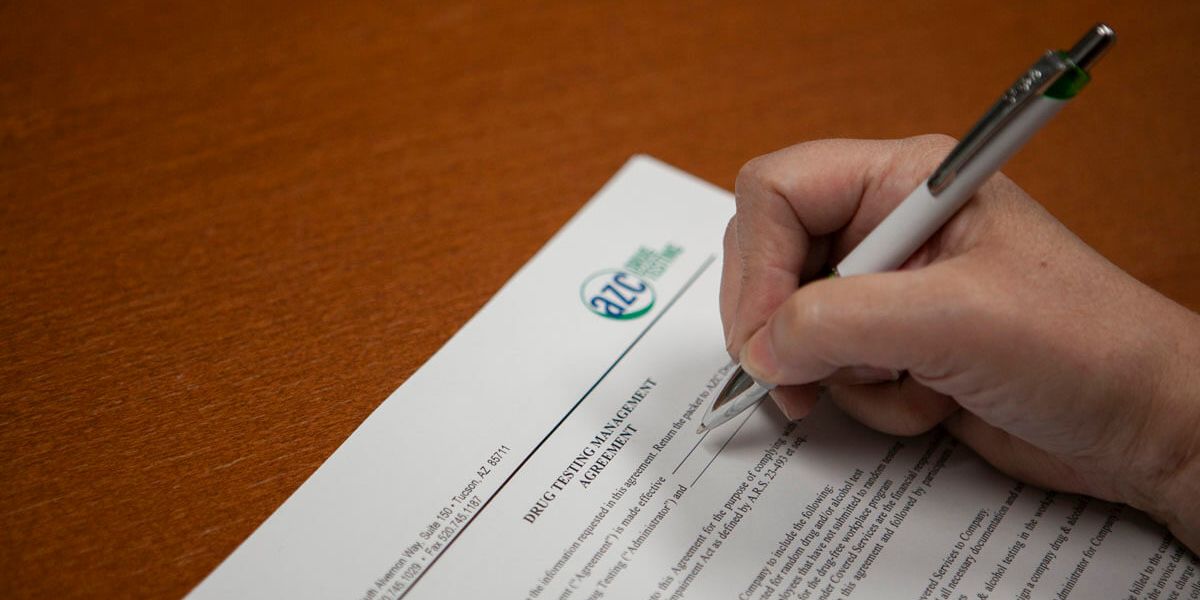 A patient signing an AZC drug testing form