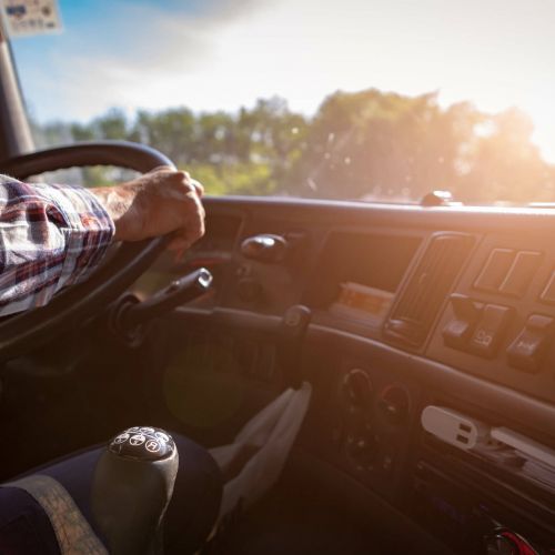 Interior of the cab of a semi-truck with professional driver