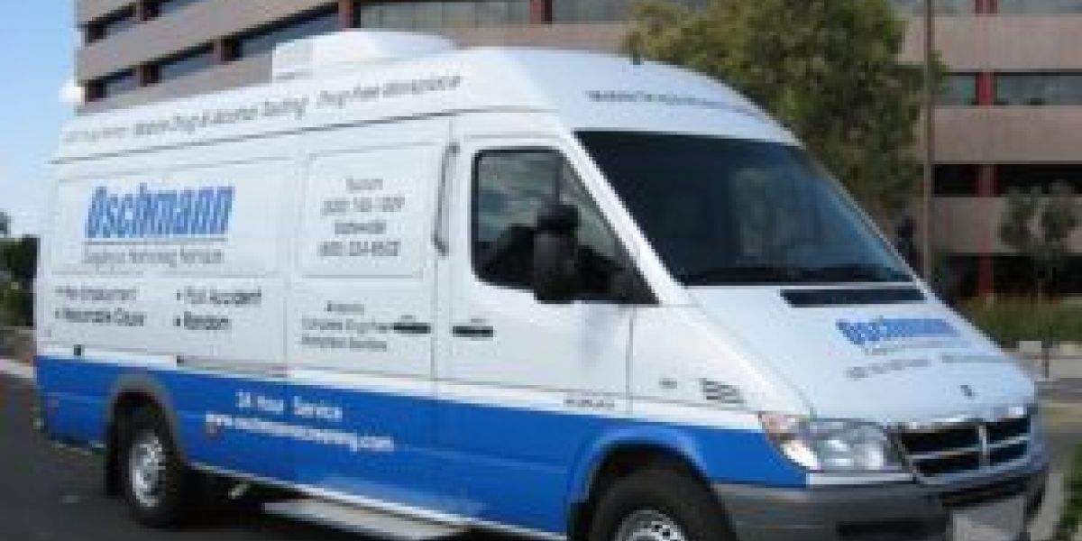 A white onsite testing van with blue lettering