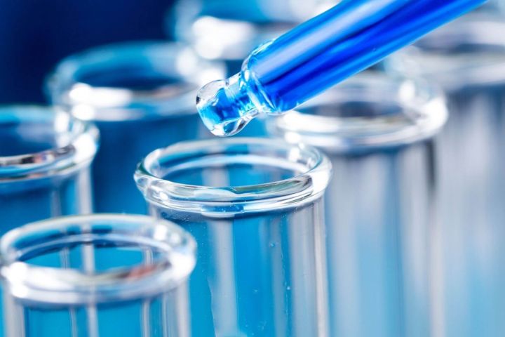 Liquid being placed into a test tube for drug testing