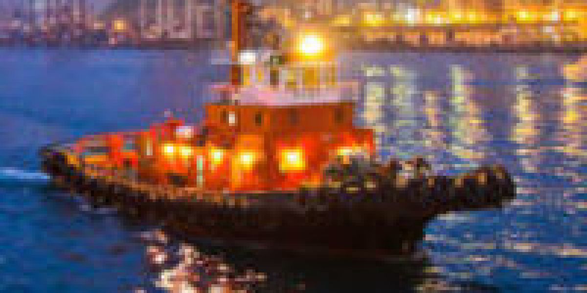 A tug boat on a river through a city