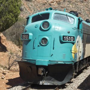 A large train travelling through hills in Southern Arizona