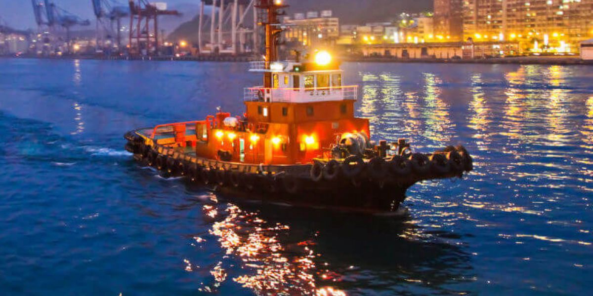 A tug boat on a river through a city