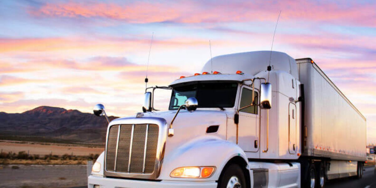 Arizona Changes Definition of “Commercial Motor Vehicle” A semi-truck travelling through the desert at sunset