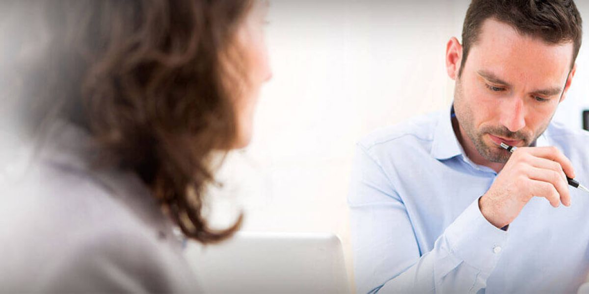 2 business professionals reviewing paperwork