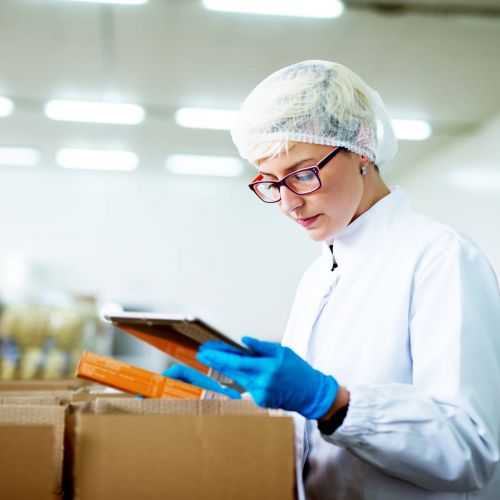 Lab worker unloading boxes of drug testing kits