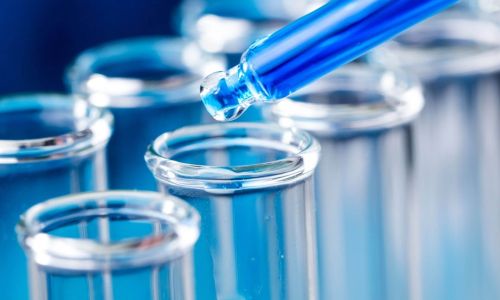 Liquid being placed into a test tube for drug testing