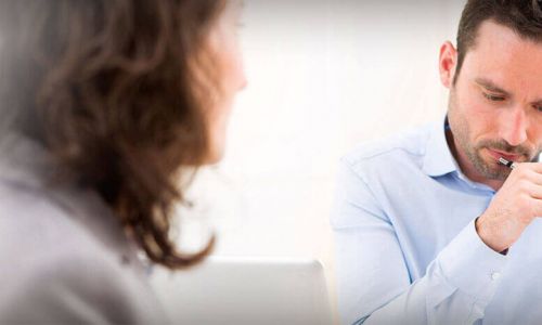 2 business professionals reviewing paperwork
